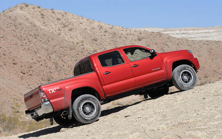 How do you shift into four-wheel drive with a 2002 Toyota Tacoma?