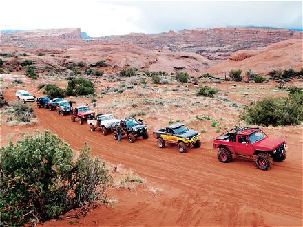 0604or_01_z+off_road_poison_spider_mesa_trail_truckin_moab+truck_line_up