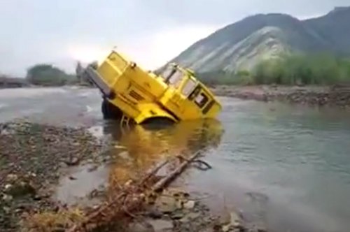 Tractor trailer stuck in a stream